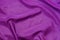 Violet silk textile rippled background texture
