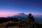 Violet in the sky of the twin mountains Sumbing and Sindoro after dawn from the top of Mount Prau, Indonesia