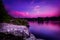 Violet Sunset Over a Calm Lake