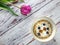 Violet tulip and bowl with cereals and blueberry on rustic table with free space