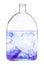 Violet watercolour dissolves in water in bottle