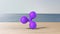 Violet xrp ripple gold sign icon on wood table blur sea with the sky. 3d render isolated illustration, cryptocurrency, crypto,