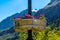 Violets flowers on the column with Alp mountains in background