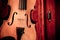 Violin and bow in dark red case. Close up view of a violin strings and bridge