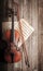 Violin, bow and musical score on wooden background