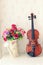 Violin and flower bouquet in living rooem