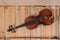 A violin image on the wood background and bow