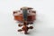 Violin lying flat with tuning pegs close to forefront on white background