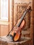 Violin lying on an old and ruined chair