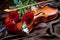Violin and red roses on a silk background. Violin and butterfly.