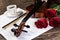 Violin, rose, coffee and music books