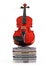 Violin standing upright on CDs