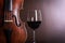 Violin waist detail with glass of wine