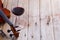 Violin and Wine on Wooden Floor with Copy Space