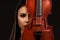 Violinist Woman portrait with violin on background