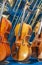 Violins standing against other musical instruments