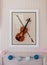 Violon with fiddlestick decoration on wall