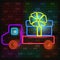 Vip neon icon. Neon Gift box icon in the back of a truck on the dark brick wall background. Flat style. Vector