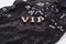 VIP is written abstract letters. Black luxurious sparkling background