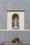 Virgin of Almudena statue in niche in Cathedral of Madrid.