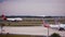 Virgin Atlantic airplane gliding on the runway and partial view of American Airlines airplanes at Orlando International Airport