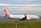 Virgin Australia passenger airplane taxiing at the airport