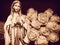 Virgin Mary mother of God praying rosary Christian statue statuette figurine and white roses