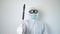 Virologist is weaing in protective clothe during coronavirus pandemic, portrait. Suit, mask, gloves and glasses on white
