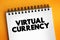 Virtual currency - digital representation of value only available in electronic form, text concept on notepad