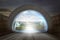 Virtual door on gateway arch to entrance mountains landscape