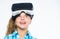 Virtual education for school pupil. Get virtual experience. Girl cute child with head mounted display on white