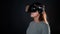 Virtual experience, a young woman using virtual reality glasses,