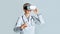 Virtual training for medical workers. Woman doctor in virtual reality glasses points finger