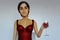 A virtual woman drinks red wine