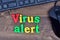 Virus alert words on table