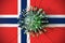 Virus breaks wall with flag of Norway. Coronavirus outbreak related conceptual 3D rendering