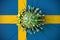 Virus crashes wall with flag of Sweden. Coronavirus pandemic related conceptual 3D rendering