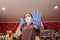 Virus. A woman in rubber gloves and a medical mask, in horror, defends her hands. Bottom view. Grocery store, small business