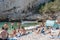 Vis, Croatia - Aug 17, 2020: Tourists sunbathing on sheltered cove Stiniva beach in summer