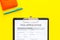 Visa prosessing. Visa application form and pen on yellow background top view copy space