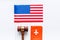 Visa to USA concept. American flag near passport and judge hammer on white background top-down