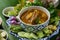 The viscera of mackerel fish paunch hot spicy curry or fish organs sour soup with vegetables, Thai food