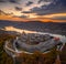 Visegrad, Hungary - Aerial panoramic drone view of the beautiful high castle of Visegrad with autumn foliage and trees