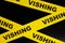 Vishing scam alert, caution and warning concept. Yellow barricade tape with word vishing