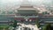 Visible smog above Beijing and tourists trying to sightseeing the Forbidden City