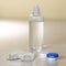 Vision correction kit. Lenses, lens container, liquid