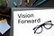 Vision forward text on white paper.motivation to success