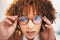 Vision, glasses and black woman, face and portrait with eye care, designer frame with prescription lens. Closeup