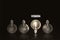 Vision , illuminated light bulb row dim ones concept solution