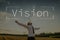 Vision text over businessman with open arms